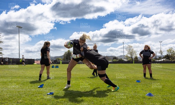 271022 - Wales Women Rugby Training Session - Carys Williams-Morris of Wales is tackled by Kate Williams during a training session ahead of the Women’s Rugby World Cup Quarter Final against New Zealand