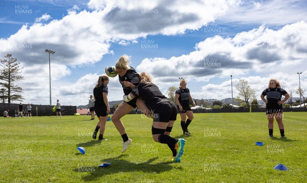271022 - Wales Women Rugby Training Session - Carys Williams-Morris of Wales is tackled by Kate Williams during a training session ahead of the Women’s Rugby World Cup Quarter Final against New Zealand