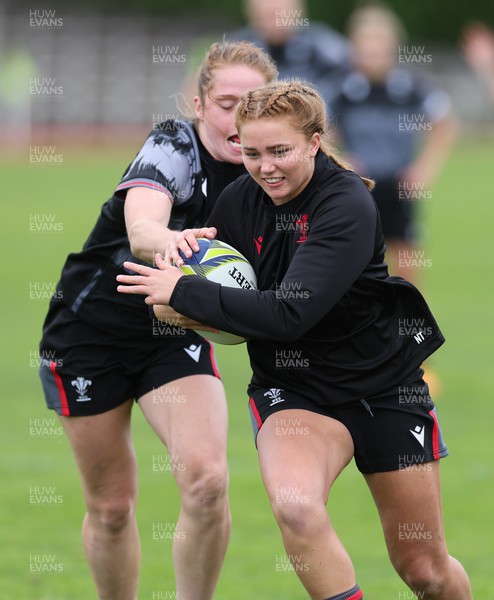 280922 - Wales Women Rugby Training Session - Wales’ Niamh Terry is caught by Lisa Neumann during a training session in Auckland ahead of the start of the Women’s Rugby World Cup