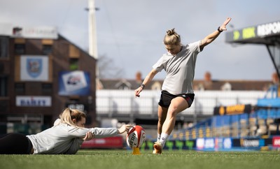 240323 - Wales Woman Rugby - Keira Bevan with assistance from Kerin Lake during Captains Walkthrough and kicking practice ahead of the opening Women’s 6 Nations match against Ireland