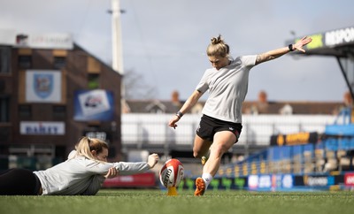 240323 - Wales Woman Rugby - Keira Bevan with assistance from Kerin Lake during Captains Walkthrough and kicking practice ahead of the opening Women’s 6 Nations match against Ireland