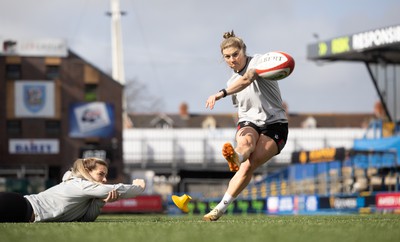 240323 - Wales Woman Rugby - Keira Bevan with assistance from Kerin Lake during Captains Walkthrough and kicking practice ahead of the opening Women’s 6 Nations match against Ireland