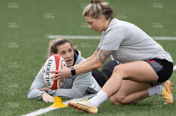 240323 - Wales Woman Rugby - Keira Bevan and Kerin Lake during Captains Walkthrough and kicking practice ahead of the opening Women’s 6 Nations match against Ireland