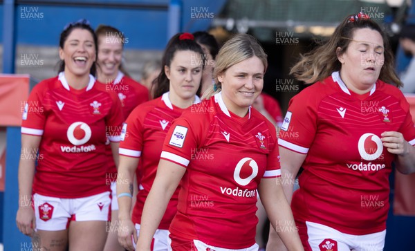 240323 - Wales Woman Rugby - The Wales Women squad walk out for a team photograph during Captains Walkthrough and kicking practice ahead of the opening Women’s 6 Nations match against Ireland