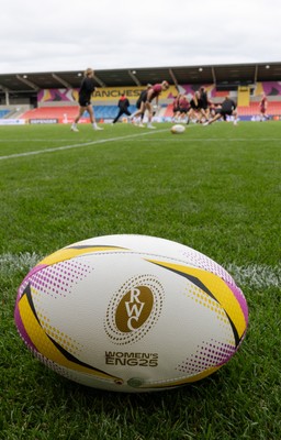 220825 - Wales Women Rugby World Cup Captain’s Run - A Rugby World Cup ball on the  pitch during Captain’s Run ahead of their first Women’s Rugby World Cup match against Scotland at the Salford Community Stadium