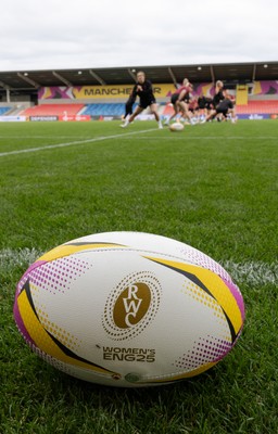 220825 - Wales Women Rugby World Cup Captain’s Run - A Rugby World Cup ball on the  pitch during Captain’s Run ahead of their first Women’s Rugby World Cup match against Scotland at the Salford Community Stadium