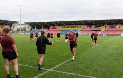 220825 - Wales Women Rugby World Cup Captain’s Run -The Wales squad warm up during Captain’s Run ahead of their first Women’s Rugby World Cup match against Scotland at the Salford Community Stadium