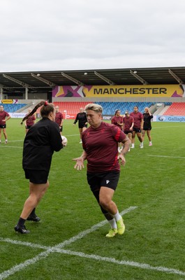 220825 - Wales Women Rugby World Cup Captain’s Run -The Wales squad warm up during Captain’s Run ahead of their first Women’s Rugby World Cup match against Scotland at the Salford Community Stadium