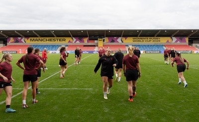 220825 - Wales Women Rugby World Cup Captain’s Run -The Wales squad warm up during Captain’s Run ahead of their first Women’s Rugby World Cup match against Scotland at the Salford Community Stadium