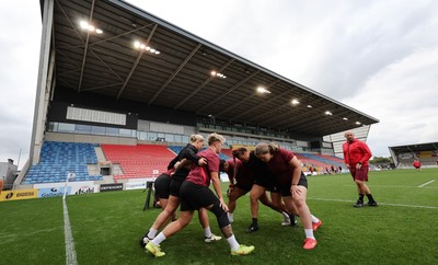 220825 - Wales Women Rugby World Cup Captain’s Run - The Wales pack scrum down during Captain’s Run ahead of Wales’ first Women’s Rugby World Cup match against Scotland at the Salford Community Stadium