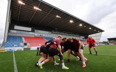 220825 - Wales Women Rugby World Cup Captain’s Run - The Wales pack scrum down during Captain’s Run ahead of Wales’ first Women’s Rugby World Cup match against Scotland at the Salford Community Stadium