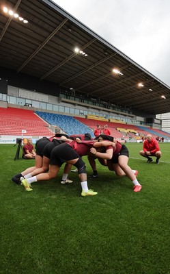 220825 - Wales Women Rugby World Cup Captain’s Run - The Wales pack scrum down during Captain’s Run ahead of Wales’ first Women’s Rugby World Cup match against Scotland at the Salford Community Stadium