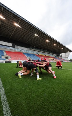 220825 - Wales Women Rugby World Cup Captain’s Run - The Wales pack scrum down during Captain’s Run ahead of Wales’ first Women’s Rugby World Cup match against Scotland at the Salford Community Stadium
