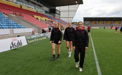 220825 - Wales Women Rugby World Cup Captain’s Run - Hannah Dallavalle, Carys Cox and Jasmine Joyce-Butchers during Captain’s Run ahead of Wales’ first Women’s Rugby World Cup match against Scotland at the Salford Community Stadium