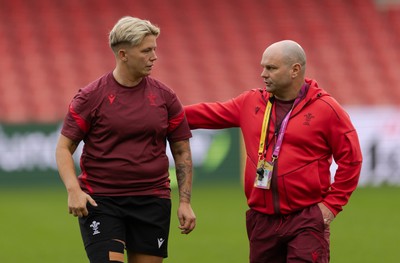 220825 - Wales Women Rugby World Cup Captain’s Run - Donna Rose with Sean Lynn, Wales Women head coach during Captain’s Run ahead of Wales’ first Women’s Rugby World Cup match against Scotland at the Salford Community Stadium