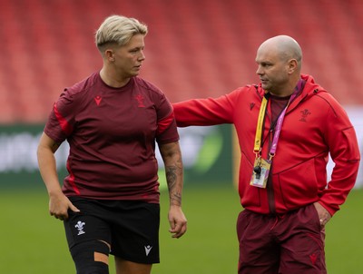 220825 - Wales Women Rugby World Cup Captain’s Run - Donna Rose with Sean Lynn, Wales Women head coach during Captain’s Run ahead of Wales’ first Women’s Rugby World Cup match against Scotland at the Salford Community Stadium
