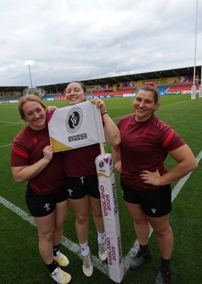220825 - Wales Women Rugby World Cup Captain’s Run - Abbie Fleming, Gwen Crabb and Gwenllian Pyrs after Captain’s Run ahead of Wales’ first Women’s Rugby World Cup match against Scotland at the Salford Community Stadium