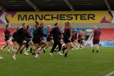 220825 - Wales Women Rugby World Cup Captain’s Run - The Wales team warm up during Captain’s Run ahead of Wales’ first Women’s Rugby World Cup match against Scotland at the Salford Community Stadium