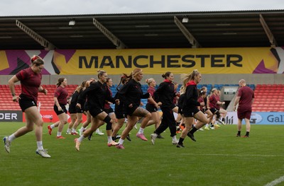 220825 - Wales Women Rugby World Cup Captain’s Run - The Wales team warm up during Captain’s Run ahead of Wales’ first Women’s Rugby World Cup match against Scotland at the Salford Community Stadium