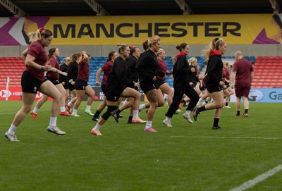 220825 - Wales Women Rugby World Cup Captain’s Run - The Wales team warm up during Captain’s Run ahead of Wales’ first Women’s Rugby World Cup match against Scotland at the Salford Community Stadium