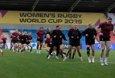 220825 - Wales Women Rugby World Cup Captain’s Run - The Wales team warm up during Captain’s Run ahead of Wales’ first Women’s Rugby World Cup match against Scotland at the Salford Community Stadium