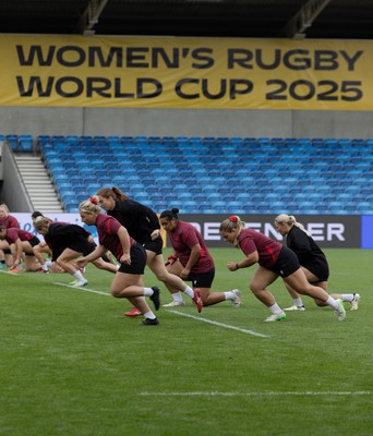 220825 - Wales Women Rugby World Cup Captain’s Run - The Wales team warm up during Captain’s Run ahead of Wales’ first Women’s Rugby World Cup match against Scotland at the Salford Community Stadium