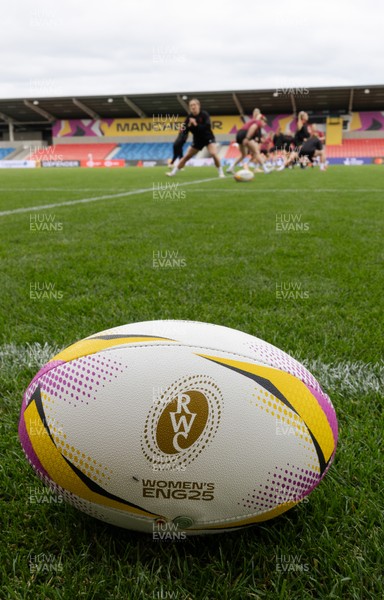 220825 - Wales Women Rugby World Cup Captain’s Run - A Rugby World Cup ball on the  pitch during Captain’s Run ahead of their first Women’s Rugby World Cup match against Scotland at the Salford Community Stadium