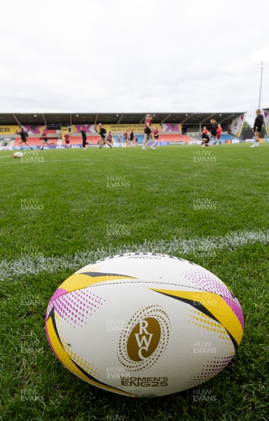 220825 - Wales Women Rugby World Cup Captain’s Run - A Rugby World Cup ball on the  pitch during Captain’s Run ahead of their first Women’s Rugby World Cup match against Scotland at the Salford Community Stadium