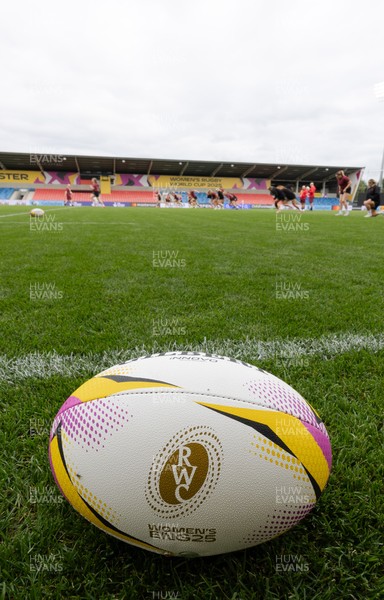 220825 - Wales Women Rugby World Cup Captain’s Run - A Rugby World Cup ball on the  pitch during Captain’s Run ahead of their first Women’s Rugby World Cup match against Scotland at the Salford Community Stadium
