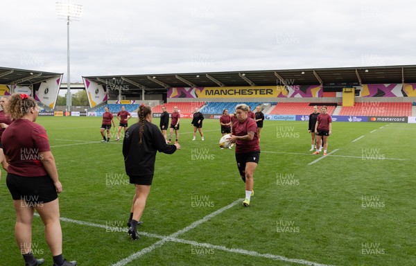 220825 - Wales Women Rugby World Cup Captain’s Run -The Wales squad warm up during Captain’s Run ahead of their first Women’s Rugby World Cup match against Scotland at the Salford Community Stadium