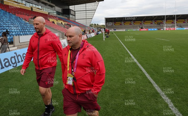 220825 - Wales Women Rugby World Cup Captain’s Run - Mike Hill, Wales Women forwards coach, and Sean Lynn, Wales Women head coach during Captain’s Run ahead of Wales’ first Women’s Rugby World Cup match against Scotland at the Salford Community Stadium