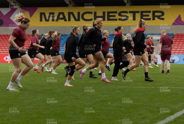 220825 - Wales Women Rugby World Cup Captain’s Run - The Wales team warm up during Captain’s Run ahead of Wales’ first Women’s Rugby World Cup match against Scotland at the Salford Community Stadium