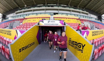 290825 - Wales Women Rugby World Cup Captain’s Run - The Wales squad make their way to the pitch at Salford Community Stadium for Captain’s Run ahead of the Rugby World Cup match against Canada