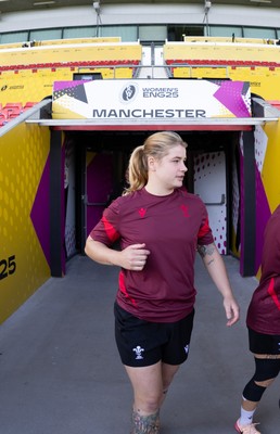 290825 - Wales Women Rugby World Cup Captain’s Run - Bethan Lewis of Wales makes her way to the pitch at Salford Community Stadium for Captain’s Run ahead of the Rugby World Cup match against Canada