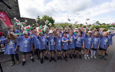 150725 - Wales Women Women’s Rugby World Cup 2025 Kit Launch, National Botanical Gardens of Wales - Schoolchildren sing at the kit launch