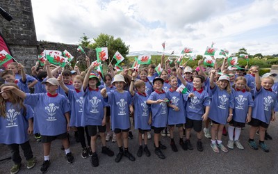 150725 - Wales Women Women’s Rugby World Cup 2025 Kit Launch, National Botanical Gardens of Wales - Schoolchildren sing at the kit launch