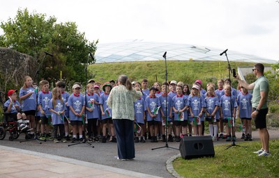 150725 - Wales Women Women’s Rugby World Cup 2025 Kit Launch, National Botanical Gardens of Wales - Schoolchildren sing at the kit launch