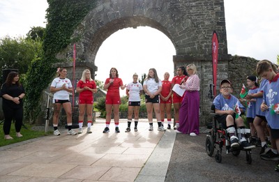 150725 - Wales Women Women’s Rugby World Cup 2025 Kit Launch, National Botanical Gardens of Wales - Wales players Georgia Evans, Alex Callender, Kate Williams, Keira Beva, Maisie Davies, Molly Reardon ands Sisilia Tuipulotu at the launch of the Wales Women’s Rugby World Cup kit at the National Botanical Gardens of Wales