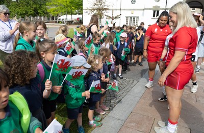 150725 - Wales Women Women’s Rugby World Cup 2025 Kit Launch, National Botanical Gardens of Wales - Alex Callender and Sisilia Tuipulotu with schoolchildren at the launch of the Wales Women’s Rugby World Cup kit at the National Botanical Gardens of Wales