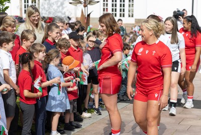 150725 - Wales Women Women’s Rugby World Cup 2025 Kit Launch, National Botanical Gardens of Wales - Kate Williams and Molly Reardon  with schoolchildren at the launch of the Wales Women’s Rugby World Cup kit at the National Botanical Gardens of Wales