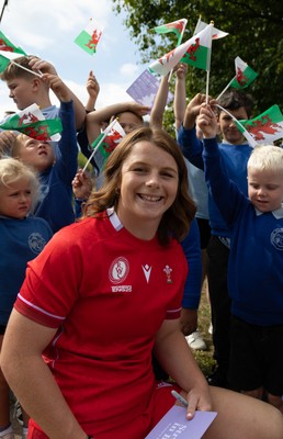 150725 - Wales Women Women’s Rugby World Cup 2025 Kit Launch, National Botanical Gardens of Wales - Kate Williams with schoolchildren at the launch of the Wales Women’s Rugby World Cup kit at the National Botanical Gardens of Wales