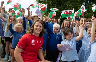 150725 - Wales Women Women’s Rugby World Cup 2025 Kit Launch, National Botanical Gardens of Wales - Kate Williams with schoolchildren at the launch of the Wales Women’s Rugby World Cup kit at the National Botanical Gardens of Wales