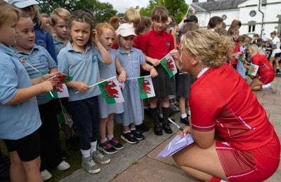 150725 - Wales Women Women’s Rugby World Cup 2025 Kit Launch, National Botanical Gardens of Wales - Molly Reardon with schoolchildren at the launch of the Wales Women’s Rugby World Cup kit at the National Botanical Gardens of Wales