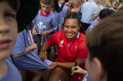 150725 - Wales Women Women’s Rugby World Cup 2025 Kit Launch, National Botanical Gardens of Wales - Sisilia Tuipulotu with schoolchildren at the launch of the Wales Women’s Rugby World Cup kit at the National Botanical Gardens of Wales