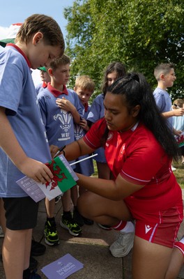 150725 - Wales Women Women’s Rugby World Cup 2025 Kit Launch, National Botanical Gardens of Wales - Sisilia Tuipulotu with schoolchildren at the launch of the Wales Women’s Rugby World Cup kit at the National Botanical Gardens of Wales
