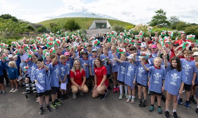 150725 - Wales Women Women’s Rugby World Cup 2025 Kit Launch, National Botanical Gardens of Wales - Wales players, join with schoolchildren at the launch of the Wales Women’s Rugby World Cup kit at the National Botanical Gardens of Wales