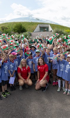 150725 - Wales Women Women’s Rugby World Cup 2025 Kit Launch, National Botanical Gardens of Wales - Wales players, join with schoolchildren at the launch of the Wales Women’s Rugby World Cup kit at the National Botanical Gardens of Wales