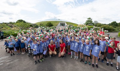150725 - Wales Women Women’s Rugby World Cup 2025 Kit Launch, National Botanical Gardens of Wales - Wales players, join with schoolchildren at the launch of the Wales Women’s Rugby World Cup kit at the National Botanical Gardens of Wales