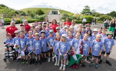 150725 - Wales Women Women’s Rugby World Cup 2025 Kit Launch, National Botanical Gardens of Wales - Wales players, join with schoolchildren at the launch of the Wales Women’s Rugby World Cup kit at the National Botanical Gardens of Wales