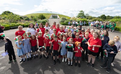 150725 - Wales Women Women’s Rugby World Cup 2025 Kit Launch, National Botanical Gardens of Wales - Wales players, join with schoolchildren at the launch of the Wales Women’s Rugby World Cup kit at the National Botanical Gardens of Wales